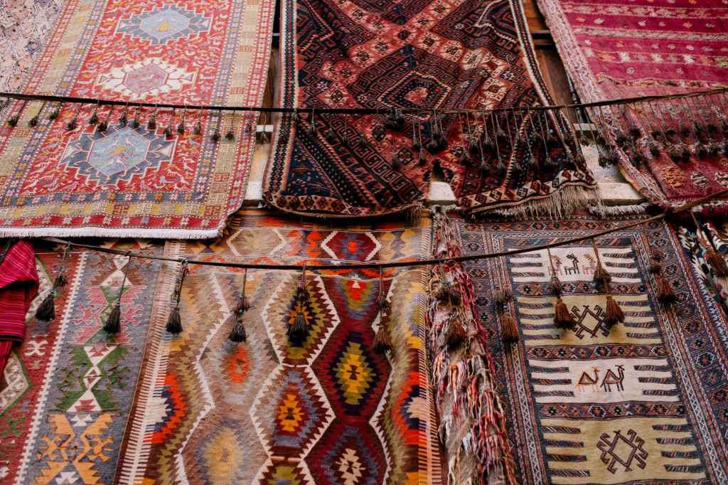 ornamental handmade rugs in open market